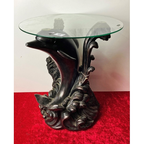 19 - A small glass topped dolphin design coffee or side table - 50 cm tall