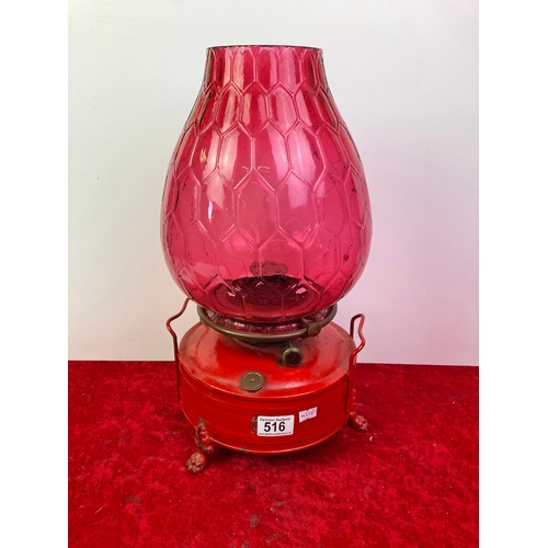 516 - Large oil lamp with red/pink shade - approx 43 cm tall