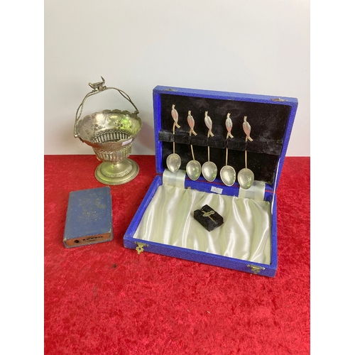 651 - A box containing five Nacasaki white metal teaspoons with leaf design, along with a post office savi... 