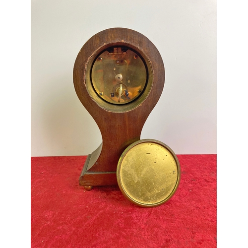 737 - French clock in an ornate wooden case with inlaid detail