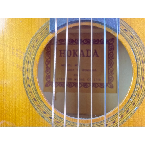 938 - Small Okada child's guitar in a case