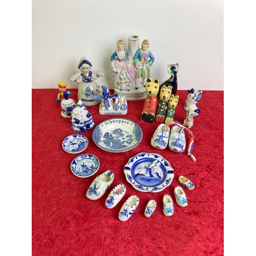 986 - Collectible blue and white souvenirs, figurines, glass cat and wooden rabbits