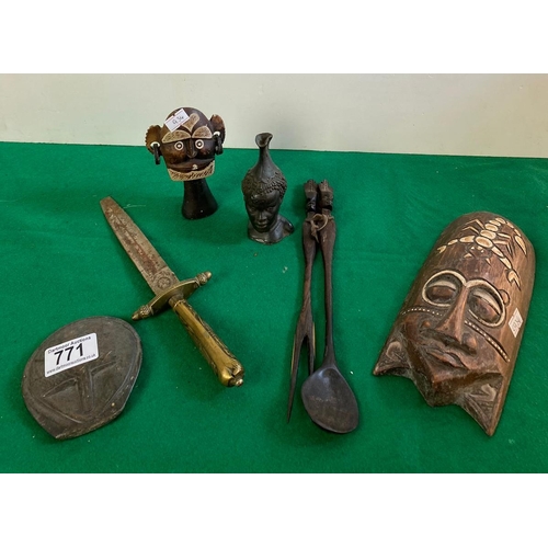 771 - Good selection of ethnic wooden and stone carved items along with a brass dagger