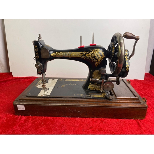 299 - A wooden cased SInger Sewing Machine