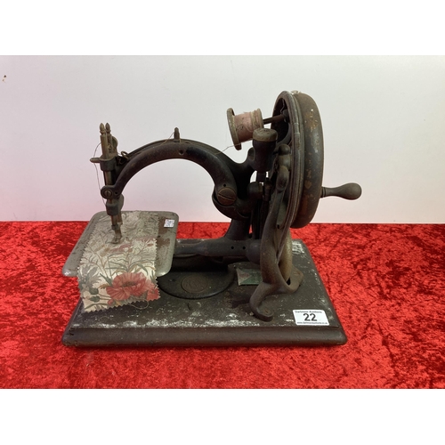 22 - Vintage hand operated sewing machine on wooden base