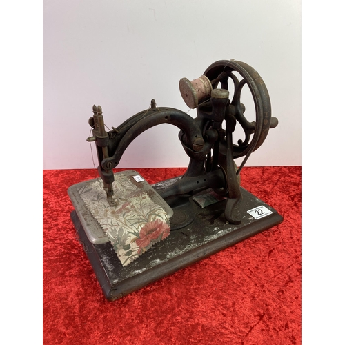 22 - Vintage hand operated sewing machine on wooden base