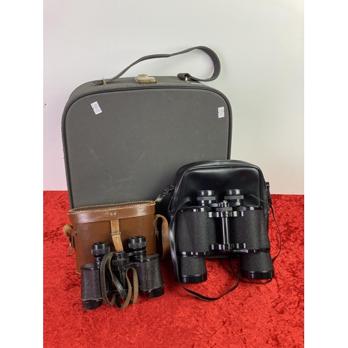 26 - 60's style grey suitcase , and two sets of binoculars in cases.