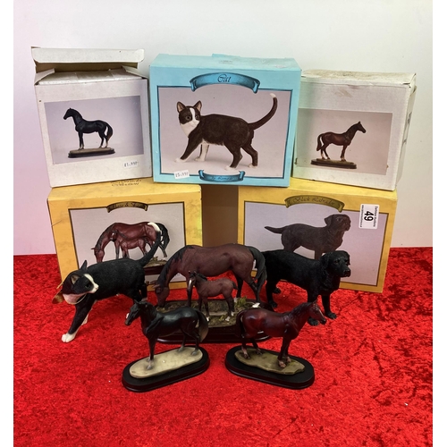 49 - Three horse, one cat, and one dog figures in boxes