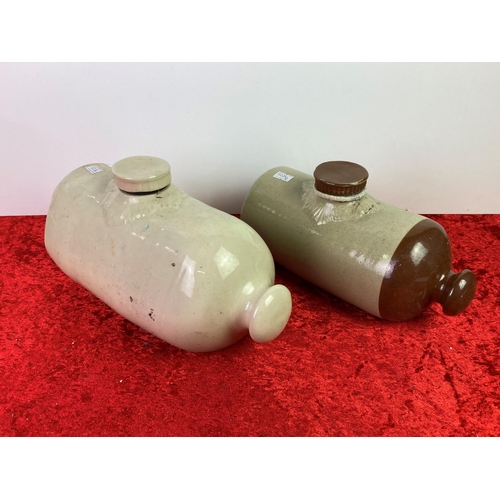 67 - Two earthenware hot water bottles