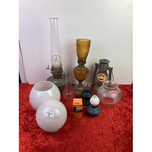 7 - Glass lamp shades, oil lamps, and original Neir Feverhand lantern