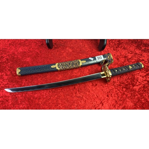 233 - Pair of samurai style swords on a stand