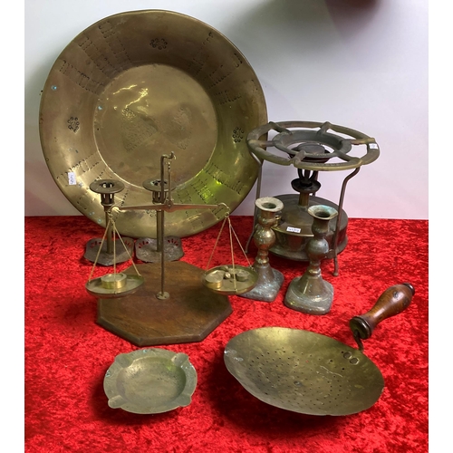 21 - A quantity of brassware including scales, large dish and candlesticks etc