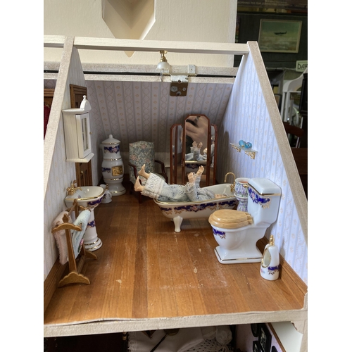 190l - 4-storey dolls house with exceptional detail in furnishings. Flooring lifted in places. Approx 100cm... 