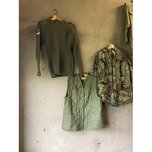 192 - Quantity of Army uniform, inc combat smock, trousers, shirt, jumper, boots, socks, & plimsolls