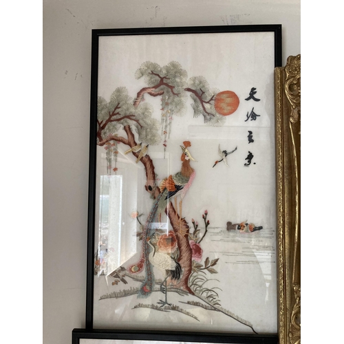 473 - A pair of Oriental embroidered pictures depicting exotic birds - approx 63cm x 38cm