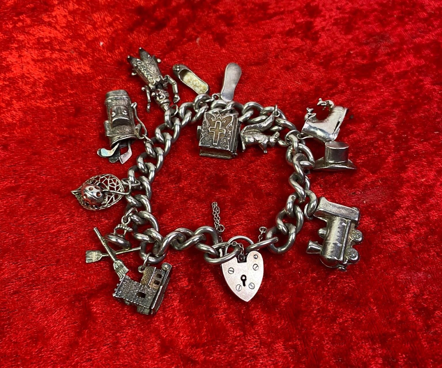 Heavy silver store charm bracelet