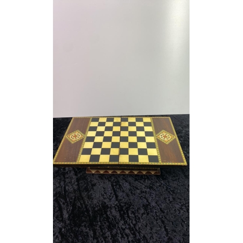 142 - Beautifully inlaid chess box by V Molero Grenada, with fold open chessboard top and wooden chess pie... 