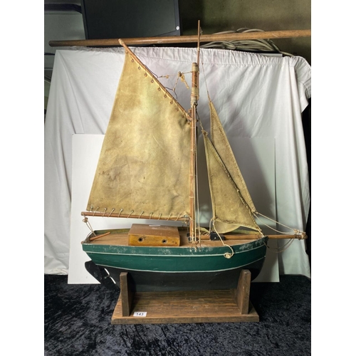 143 - Gorgeous wooden sailing boat on stand. Beautifully naively made. H92cm L74cm