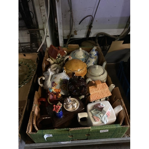 232 - A box of collectors’ teapots with some quirky and unusual designs, including one doughnut-shaped tea... 