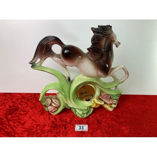 33 - Surreal galloping horse image manual ceramic mantle clock. Made in Italy. Height approx 39cm, base l... 