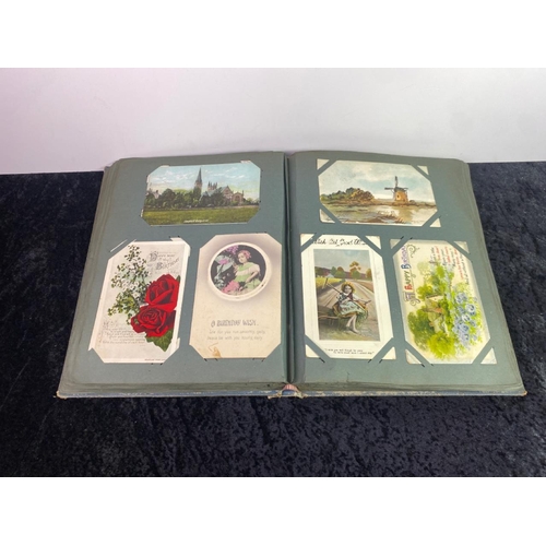 358 - Album of antique early 20th Century postcards, some sent with stamps, inc. Christmas and Birthday ca... 