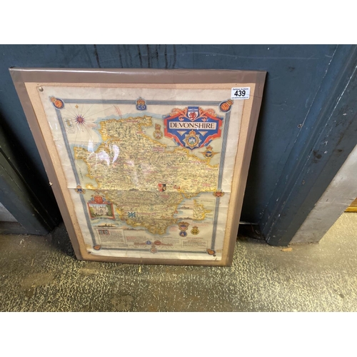 439 - Old promotional map of Devonshire behind clear film on a board measuring 63 cm H x 53 cm W