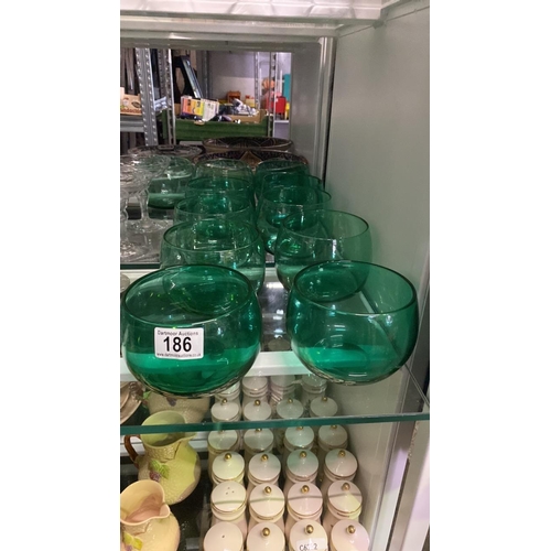 186 - 11 green glass bowls, all slightly different