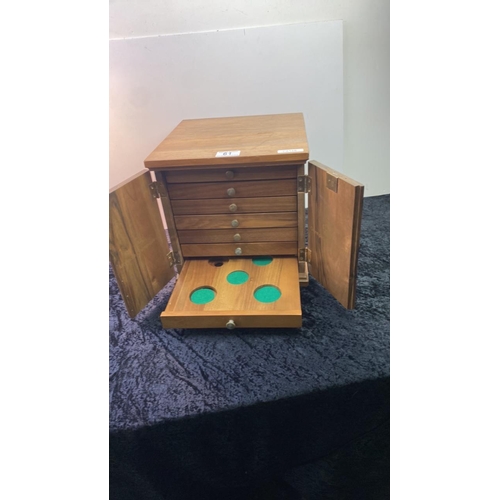 61 - A collectors cabinet with coin drawers designed for a 1976 Olympic Games coin collection