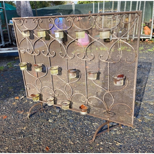 701 - Fire screen with tea light candle holders, approx 88cm x 79cm along a large candlabra, both suitable... 