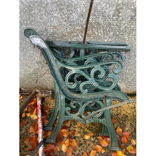 711 - Two cast iron bench ends and two table legs