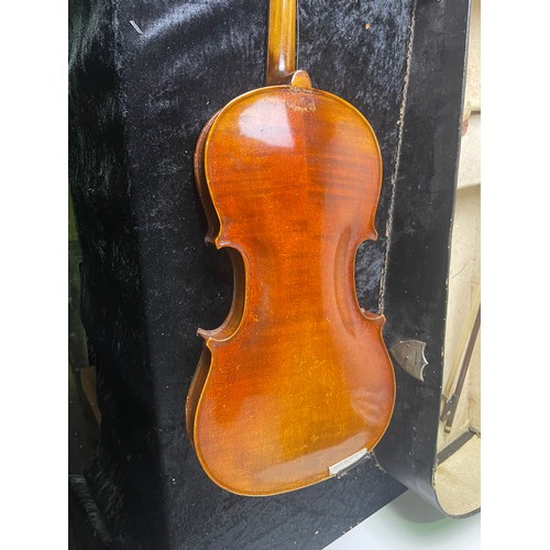 79 - Violin marked 'Stainer' in case with two bows, likely a copy, bridge loose