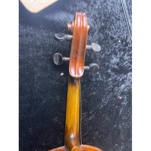 79 - Violin marked 'Stainer' in case with two bows, likely a copy, bridge loose