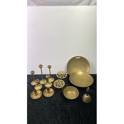 103 - Collection of brass items inc. dishes, candlesticks, trivets, bell etc