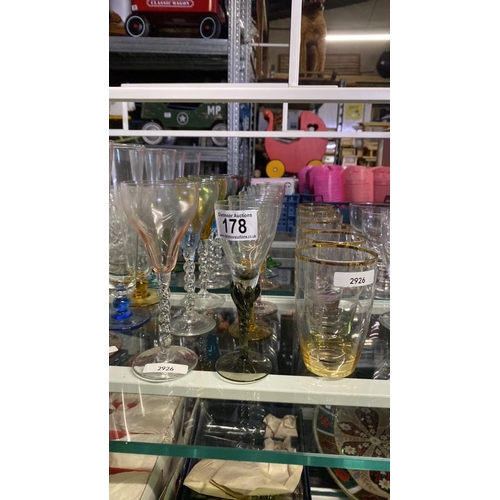 178 - 6 coloured glasses with twisted stems - one A/F along with 6 glass tumblers with etched design, colo... 