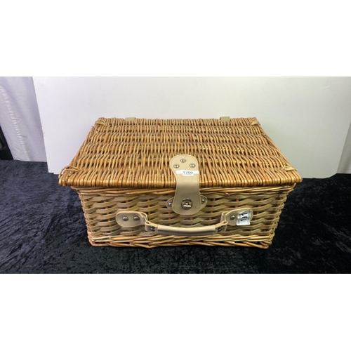 191 - A small wicker picnic basket with contents