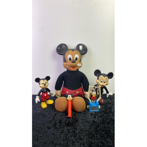 225 - A collection of vintage Mickey Mouse toys