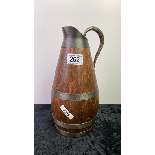 262 - A wooden and pewter style barrel pouring jug. Approx 28cm tall