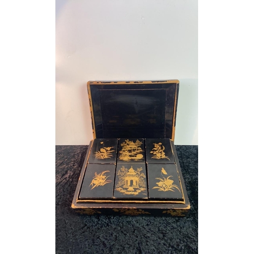 348 - Chinese lacquer wood gilt lidded game box containing boxes/trays, inlaid