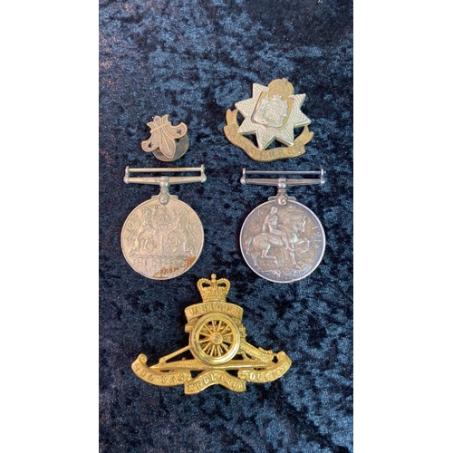 579 - Two military badges, a scout’s cap badge, a Defence medal and a World War 1 medal inscribed to 14770... 