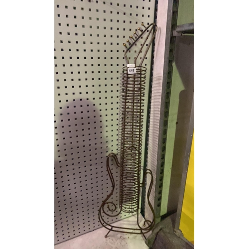 615 - A funky guitar-shaped CD rack. Approx H135cm