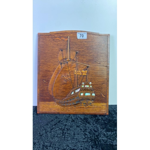 70 - Wooden hanging wall plaque depicting a sailing ship with mother of pearl detail, approx 33 x 28cm