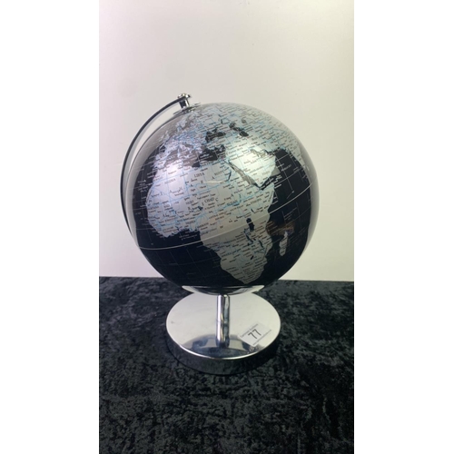 77 - Globe on a chrome stand, approx 28cm tall