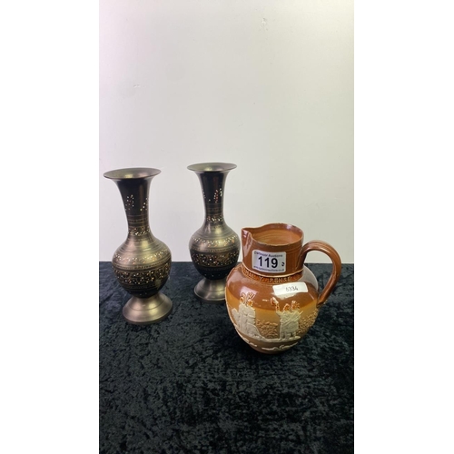 119 - Doulton Lambeth jug 14 cm tall, along with a 2 metal decorated vases