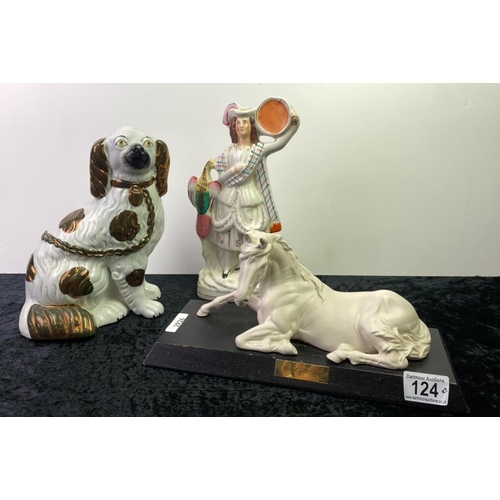 124 - A Staffordshire style dog along with a Staffordshire style flatback figurine and a resin horse on wo... 