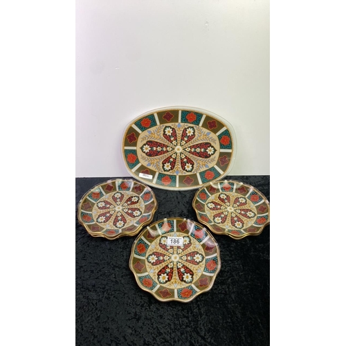 186 - A reverse printed decorative Retro glass serving dish along with 6 matching plates