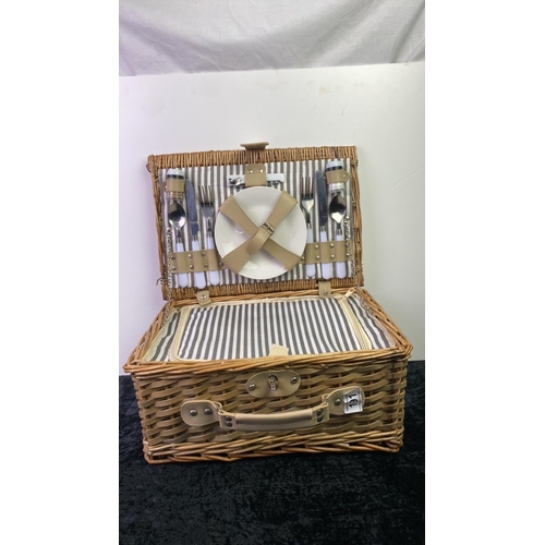 191 - A small wicker picnic basket with contents