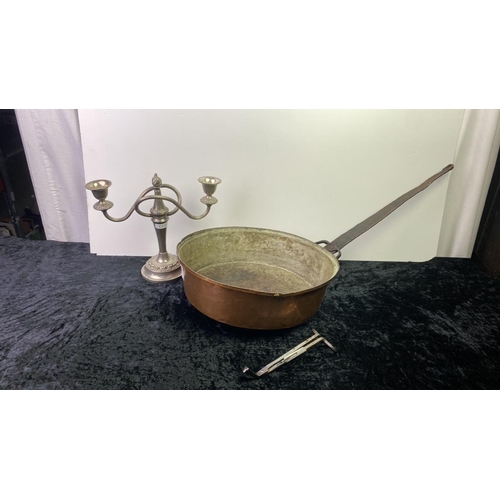 192 - A large copper pan 31cm diameter along with a silver plate candlestick and scissors