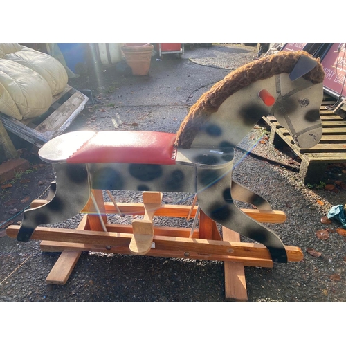 207 - A vintage wooden rocking horse