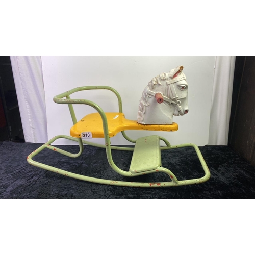 210 - A small vintage Tri-ang metal rocking horse chair