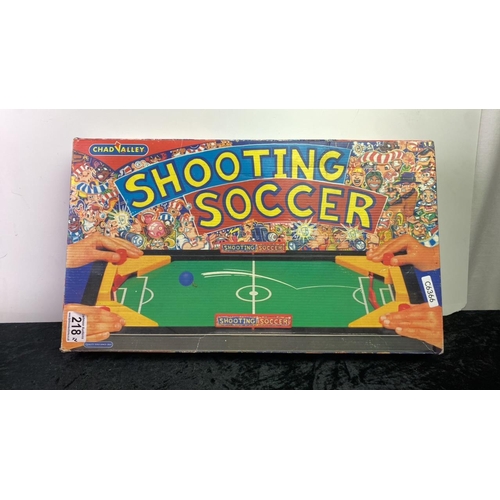 218 - A boxed vintage Monte Carlo roulette set along with a Shooting Soccer game